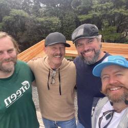 The Praxxis Group team, creators of OPAL3, pictured together outdoors in New Zealand.